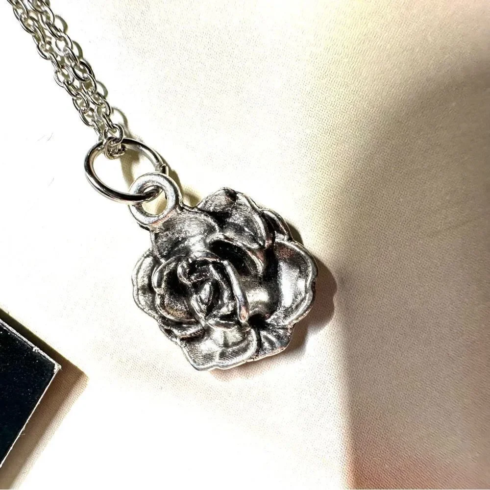 Silver tone rose pendant necklace